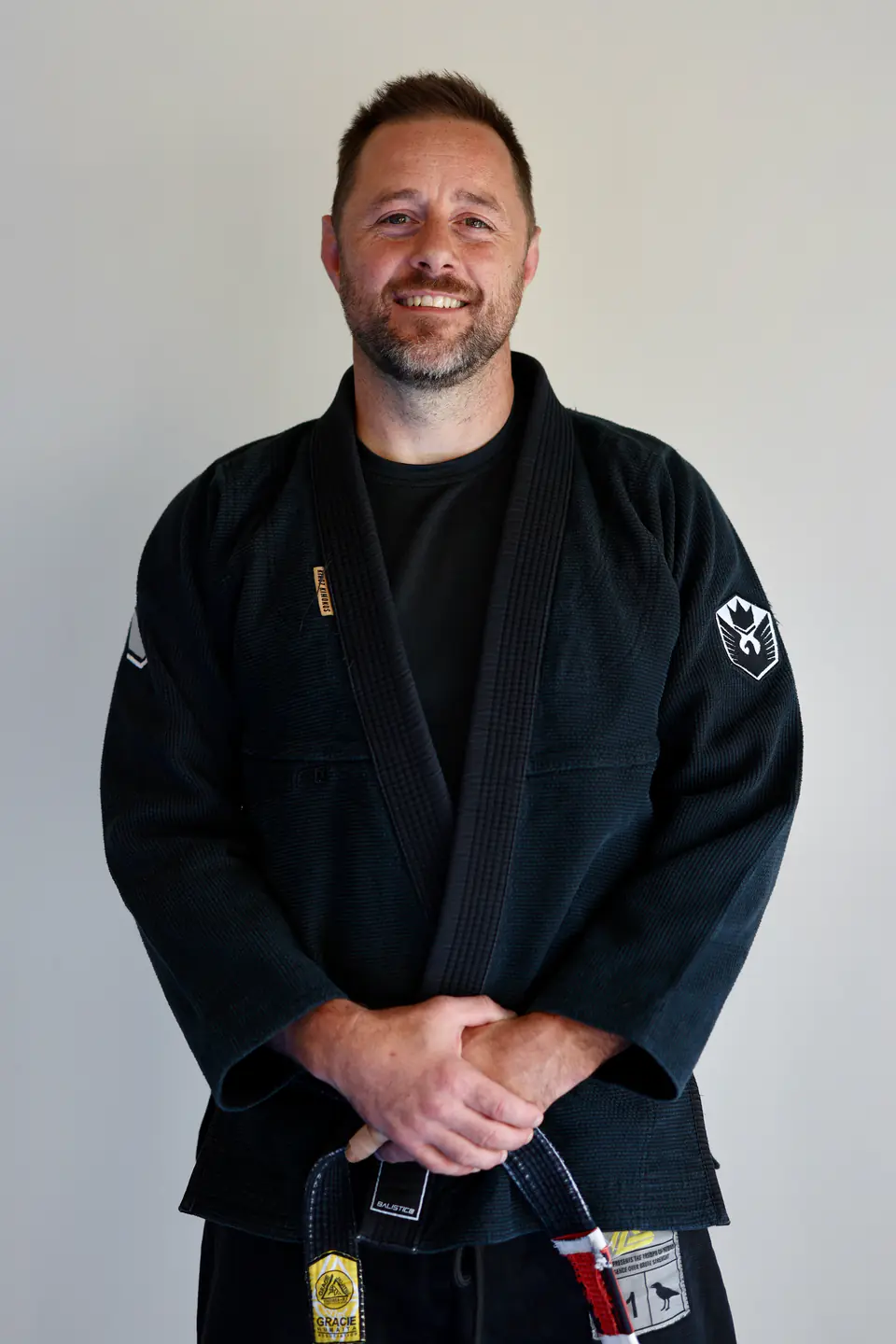 Head Professor James Pugsley wearing a black Brazilian Jiu Jitsu gi